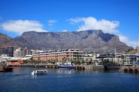 Panoramic view of Table Mountain overlooking Cape Town, South Africa, with the city skyline and Atlantic Ocean in the background
